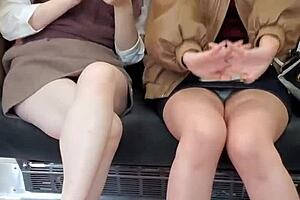 Pretty Asian girls flashing their panties on the train
