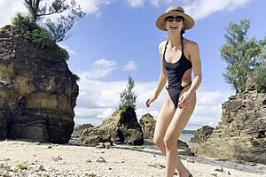 Japanese beauty enjoys solo play on the beach at the Pacific Ocean