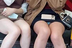 Pretty Asian girls flashing their panties on the train