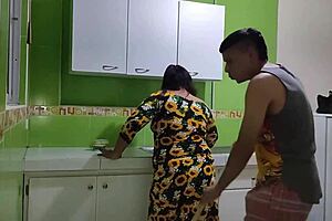 I console my sad stepmother over her husband's infidelity and help her get revenge by fucking her in the kitchen