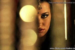 brunette indian woman dances seductively undressing nude teasing with ripped clothes