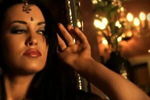 brunette indian woman dances seductively undressing nude teasing with ripped clothes