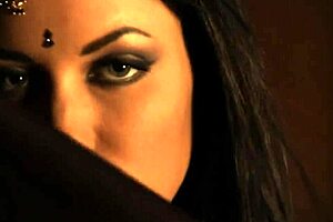 brunette indian woman dances seductively undressing nude teasing with ripped clothes