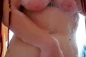 Big tits jiggling while the amateur masturbates under the shower with an unlimited orgasm