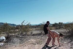 Mya Ryker and her lover having sex in a car in the middle of the desert