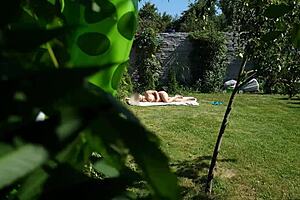 I have been spying on my step mother and she was sunbathing naked in the backyard