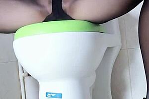 Big-Breasted Woman Masturbates In Toilet With Vibrator