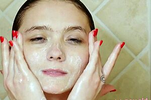 Charming brunette teen model takes shower during casting interview on sofa