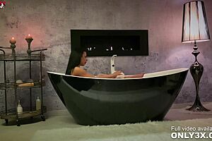 Shalina's sensual anal play in the upscale bathtub setting