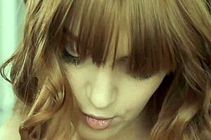 A young woman who is barely of legal age enjoys rubbing her erogenous zones
