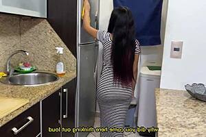 Sexy stepdaughter cleans the kitchen in a tight dress