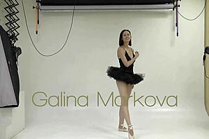 Athletic brunette gymnast stretches naked in workout