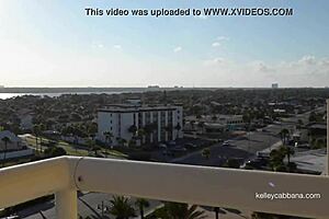 blonde milf in bikini dares to play with pussy on public balcony