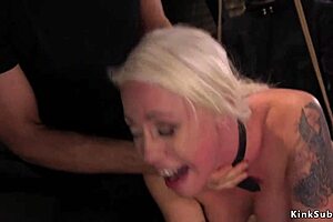 Blonde Submissive Trainee Performs Oral on Massive Cock in Bizarre Fetish Scene