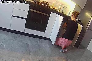A married woman has sex with a neighbor in the kitchen in this homemade video
