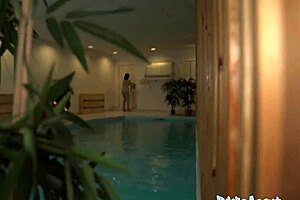 pretty brunette risks blowjob in public pool