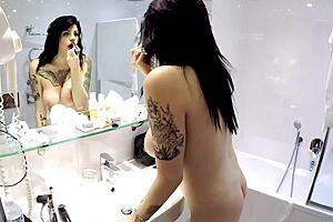 Kate teases on the bed with her pierced tits