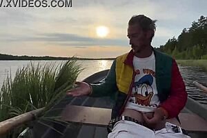 Amateur couple’s comic relief in hot lake boat sex