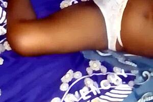 this big booty ebony babe spreads her wet pussy in the bedroom