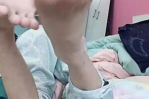 Young Asian boy enjoys foot fetish and gets fucked in the ass