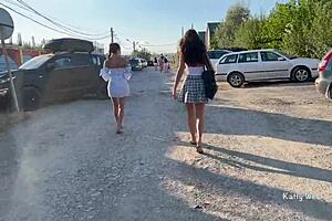 Wow, two girls flashing pussies in public with no panties on!