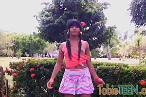 Tobie the teen enjoys solo fingering outdoors in the summer