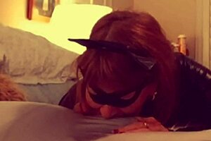 Catgranny passionately sucks batman in deepthroat action