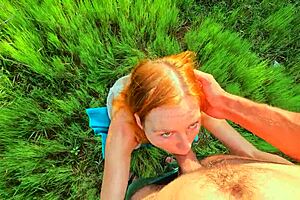 Beautiful woman with red hair gives great blow job in a hot scene with her partner