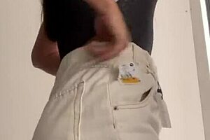 wife changing clothes in the store fitting room