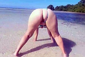 i love watching the chubby milf piss on her big fat ass at the beach