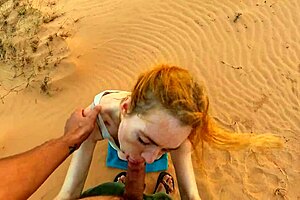 A beautiful European girlfriend gives a blowjob to her fat boyfriend in the desert