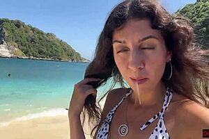 Hottie sucks dick on beach