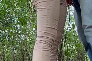 Girl has fun with her neighbor in the woods on a weekend