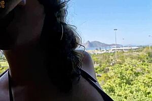A girl with glasses took a huge load in her mouth, facing a great view