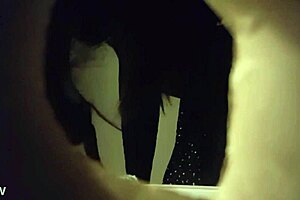 Spy cam video of a babe peeing through a wall hole