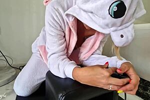 A hot MILF in a unicorn costume rides Sybian with passion