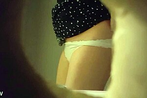 Spy cam video of a babe peeing through a wall hole
