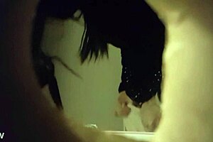 Spy cam video of a babe peeing through a wall hole