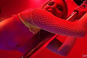 Lesbian strippers rub big tits together before fingering wet cunts.