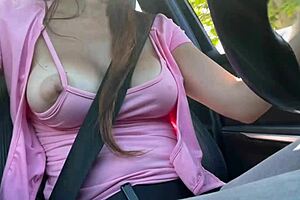 italian milf boldly flashes huge tits while driving solo in car.