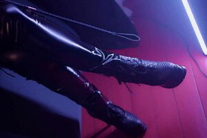 A hot MILF is using a pegging strap-on and making an ass of these guys