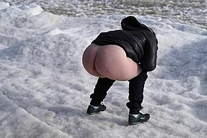 Old MILF enjoys outdoor pissing in the sea with her hairy pussy.