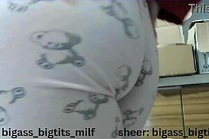 In pajamas, this milf masturbates her big ass and camel toe with dildo and vibrator.