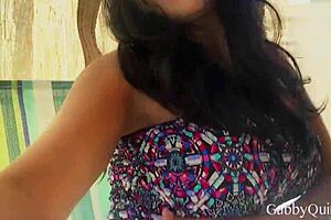 Brunette Beauty Teasingly Shows Off Natural Tits in Sensual Glamour.