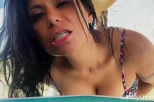 Brunette Beauty Teasingly Shows Off Natural Tits in Sensual Glamour.