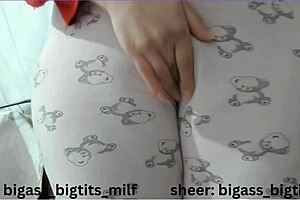 In pajamas, this milf masturbates her big ass and camel toe with dildo and vibrator.