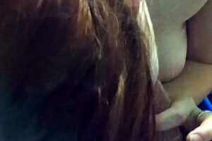 Amateur redhead passionately sucks and jerks a big cock in POV, flaunting her huge tits.