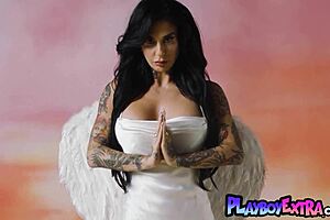 Joanna Angel strips, revealing sexy tattoos and big tits