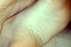 Watch this homemade footjob? Girlfriend's bare toes stroking for huge cumshot!