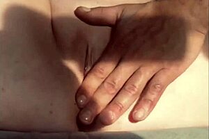 The guy masturbates his cock while watching a pussy squirting video